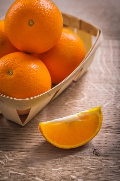 Oranges in backet on wood — Stock Photo, Image