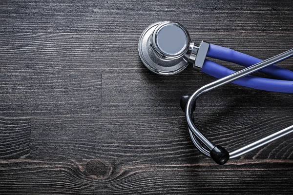 Single stethoscope on wood — Stock Photo, Image