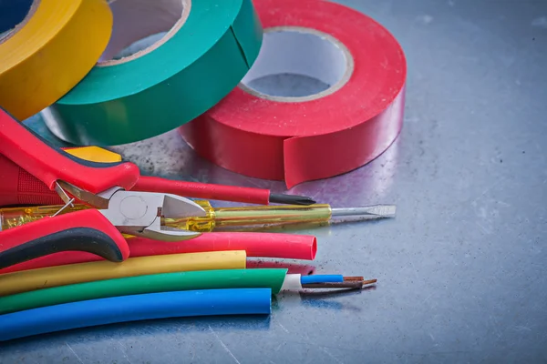 Insulating tapes, cables, turnscrew, pliers — Stock Photo, Image