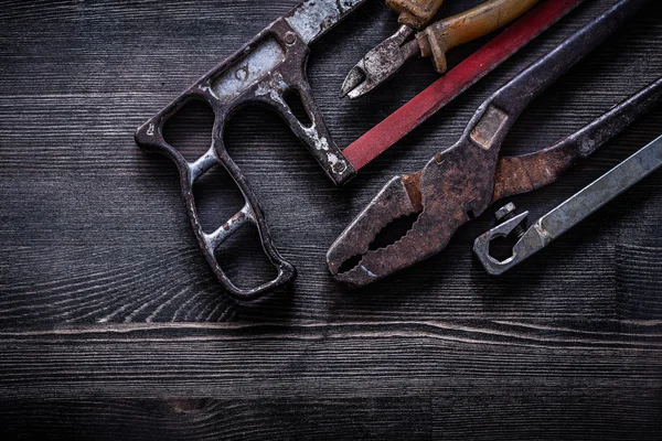 Vintage handsaw, nippers and pliers — Stock Photo, Image