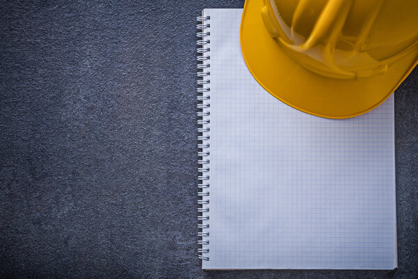 Notebook and hard hat