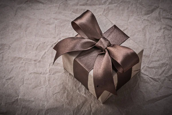 Present box with brown bow — Stock Photo, Image