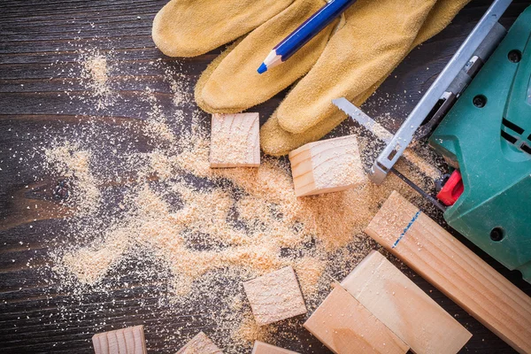 Pencil, electric sawdust, protective gloves — Stock Photo, Image