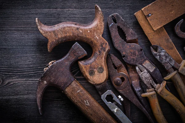 Vintage rozsdás handsaw, a fogó, a kalapács — Stock Fotó