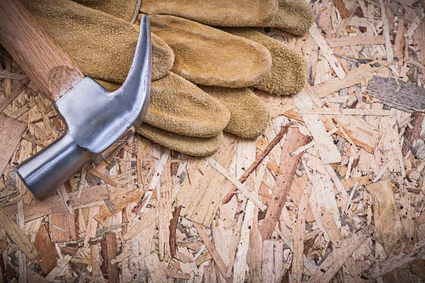 Claw hammer and leather protective gloves — Stock Photo, Image