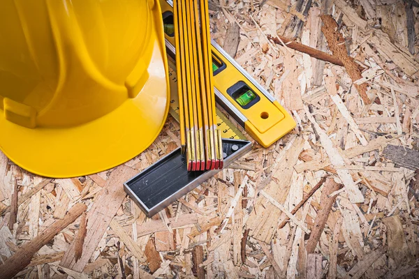 Construction level, meter and hard hat — Stock Photo, Image