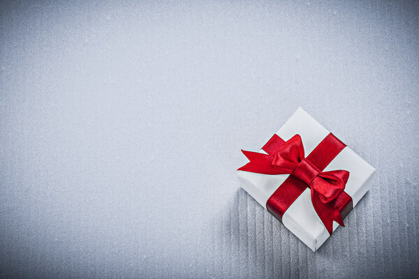 Gift box with red ribbon