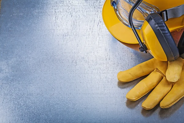 Eyewear, building helmet, glove and earmuffs — Stock Photo, Image