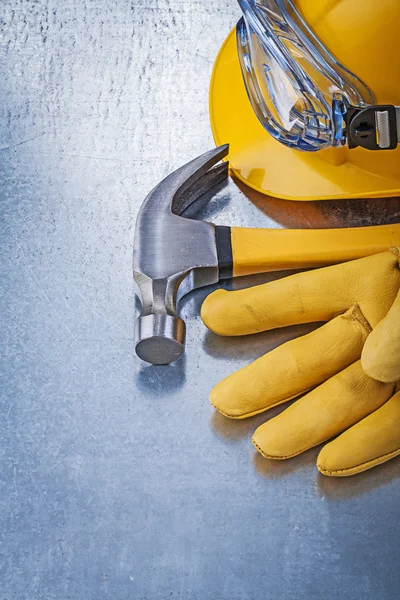 Glasses, hard hat, glove and hammer — Stock Photo, Image