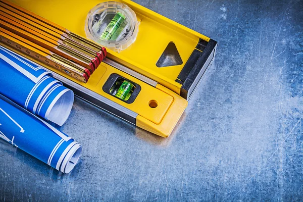 Construction plans, levels and wooden meter — Stock Photo, Image