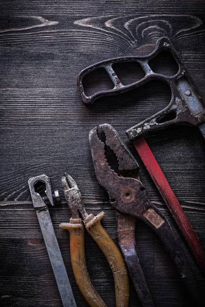 Vintage hacksaw, nippers and pliers — Stock Photo, Image