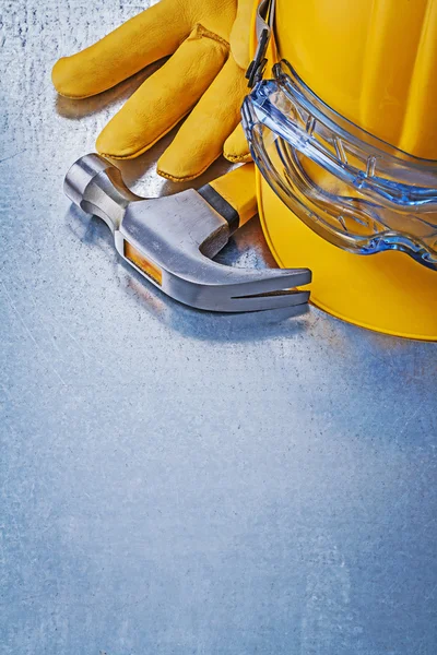 Hard hat, leather glove and hammer — Stock Photo, Image