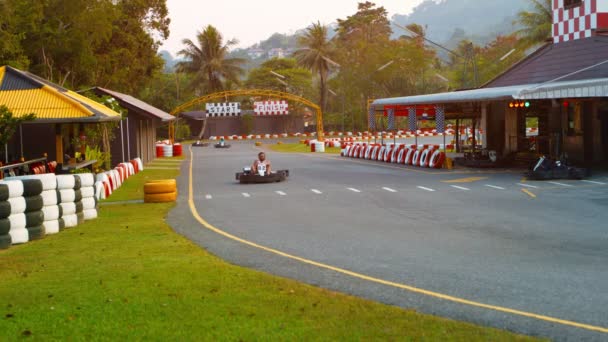 PHUKET. THAILAND - CIRCA FEB 2015: Tourists competingin a race at Patong Go-Kart Speedway in Kathu. Phuket. Thailand. — Stock Video