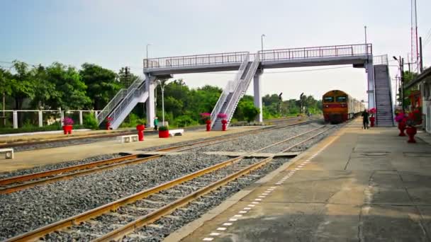 BANG PA-IN. THAILAND - CIRCA NOV 2013: Diesel-powered passenger train slows as it cruises into the station in Ayutthaya. Thailand. with sound. — Stock Video