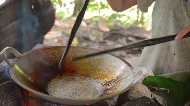 Woman Making Traditional. Native. Coconut Sweets on Borneo Island