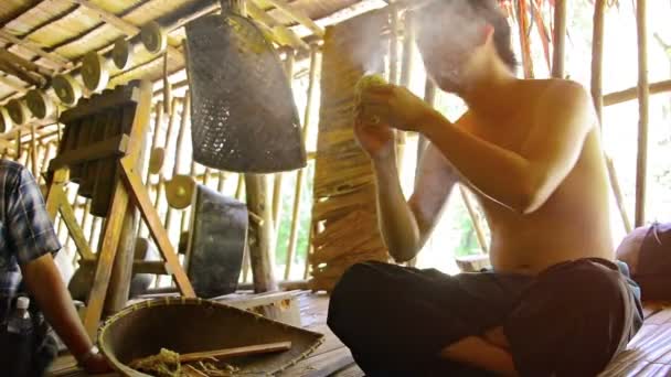 Local villager shows tourists how to start fire without matches as part of a cultural demonstration. — Stock Video