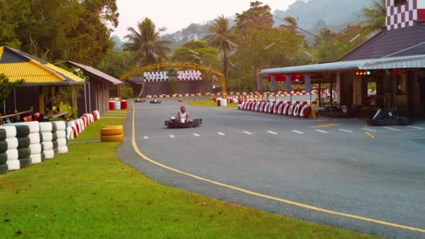 PHUKET. THAILAND - CIRCA FEB 2015: Tourists competingin a race at Patong Go-Kart Speedway in Kathu. Phuket. Thailand. — Stock Video