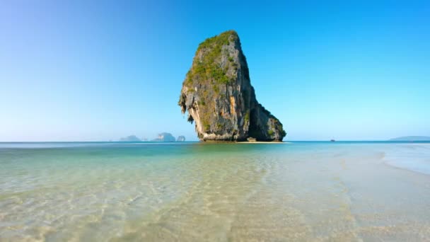 Massive Limestone Rock Formations Towering over Tropical Beach — Stock Video