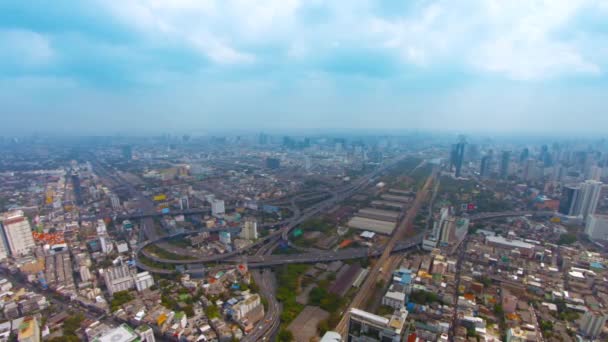 Bangkok cityscape. Thailand's capital city. on a. hazy day. with a highway junction — Stock Video