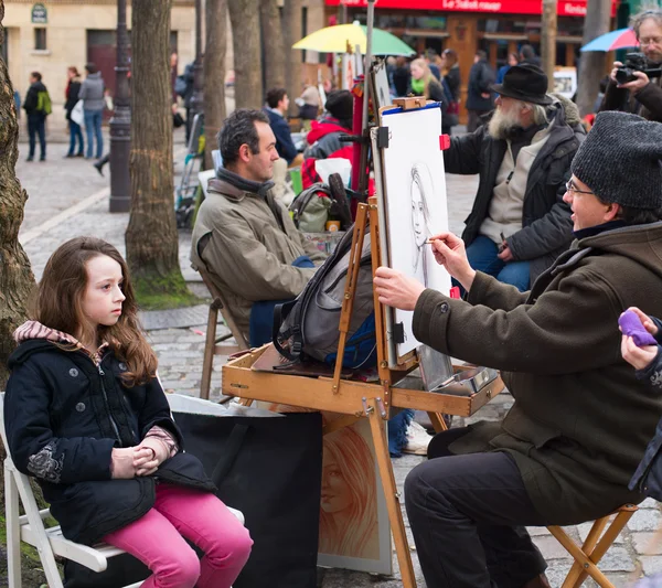 Montmartre artist drawing a portrait — Stock Photo, Image