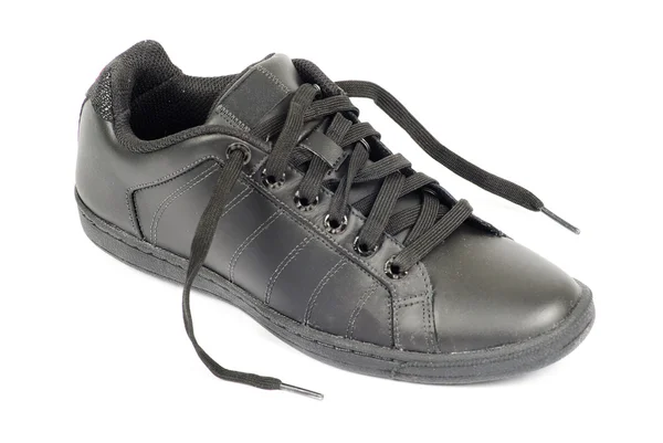 Черная обувь изолирована от белой — стоковое фото