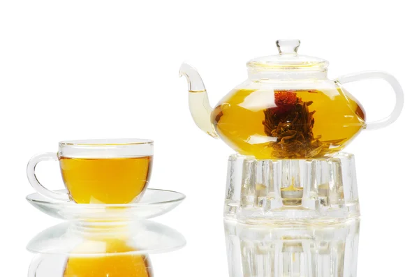 Glass cup of tea and teapot — Stock Photo, Image