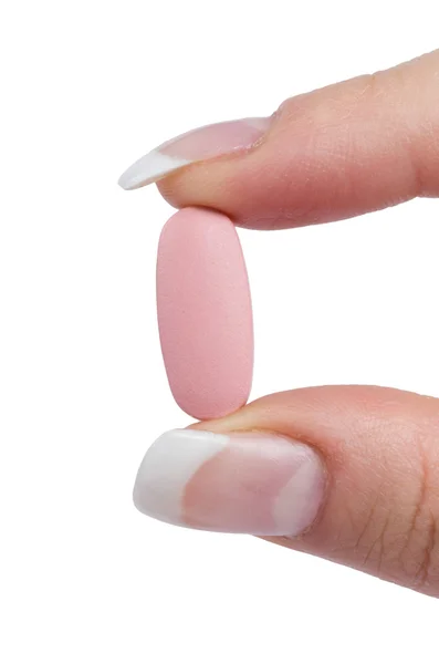 Hand holds pill — Stock Photo, Image