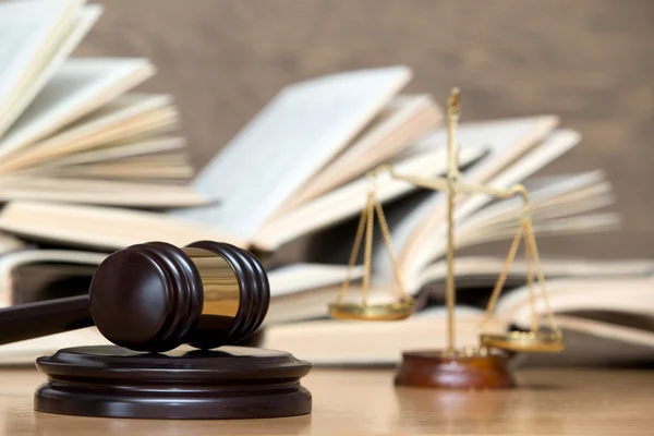 Wooden gavel and books Stock Picture