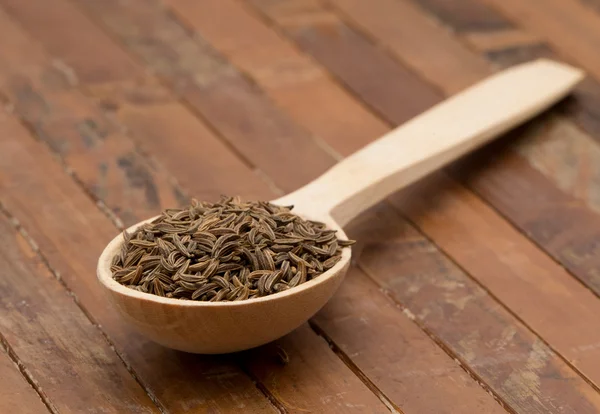 Cumin seeds in  spoon — Stock Photo, Image