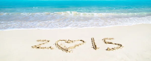 2015 teken op strand — Stockfoto