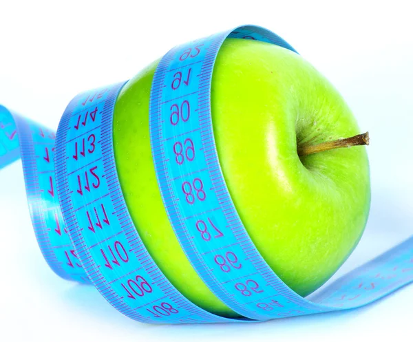 Zelené jablko a měřicí páska — Stock fotografie