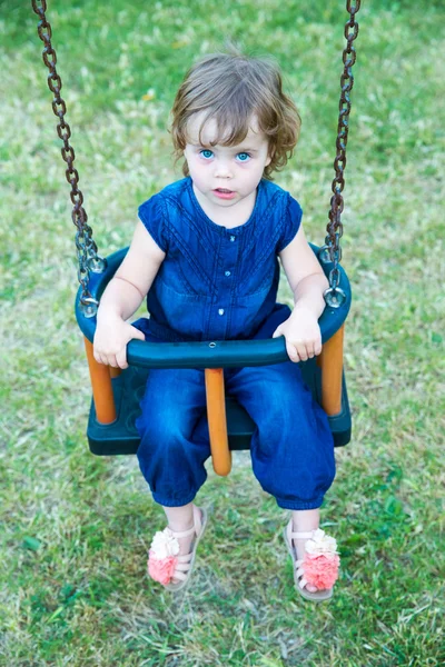 Little girl  on  swing outdoor — Stock Photo, Image
