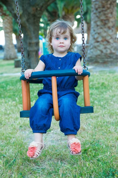 Little girl  on swing outdoor — Stock Photo, Image