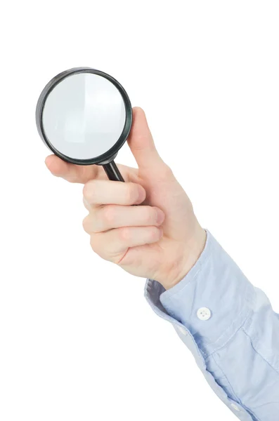 Hand holding magnifying glass — Stock Photo, Image