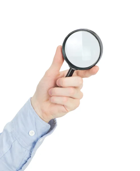 Mans hand and magnifying glass — Stock Photo, Image