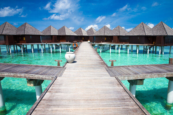 beach with bungalows at Maldives