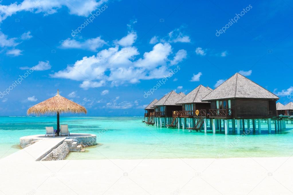 beach with water bungalows