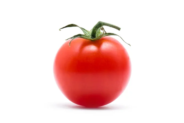 Tomato with green leaves Stock Image
