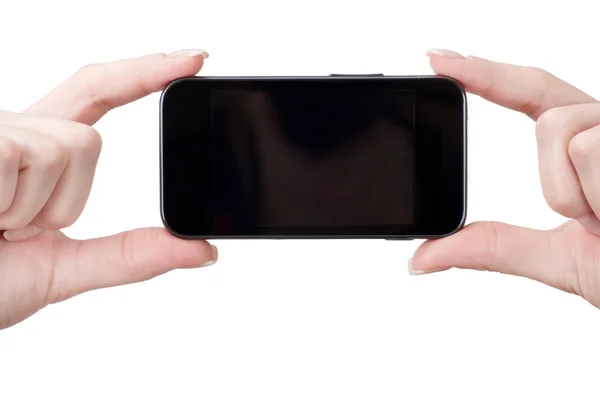 Мобильный телефон в женских руках — стоковое фото