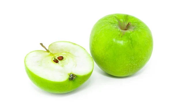 Celek a polovinu ze zelených jablek — Stock fotografie