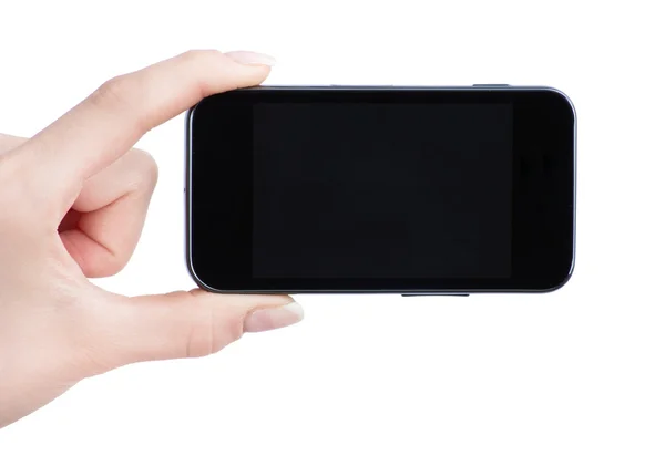 Mobiltelefon i kvindelig hånd - Stock-foto