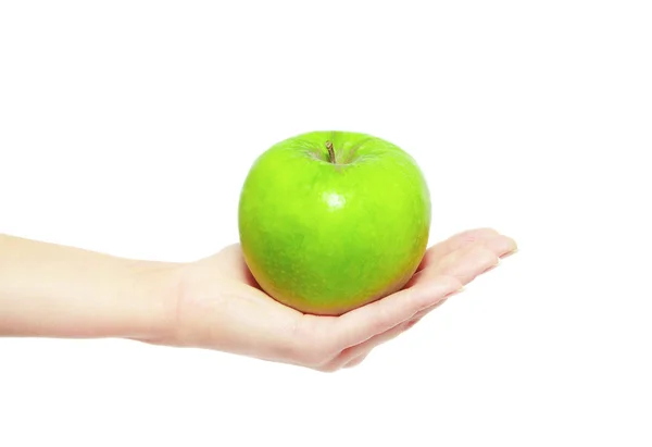 Mão segurando maçã verde — Fotografia de Stock