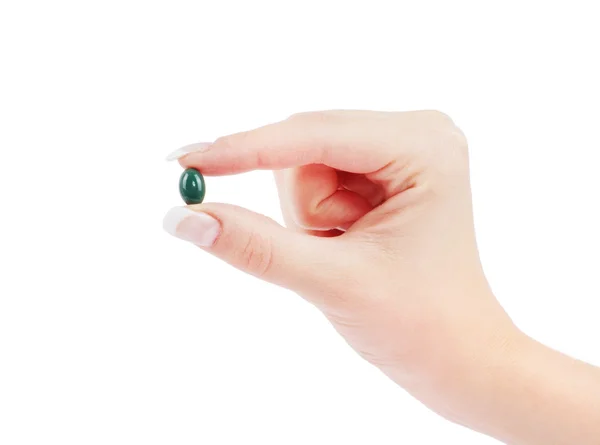 Medical pill in female hand — Stock Photo, Image