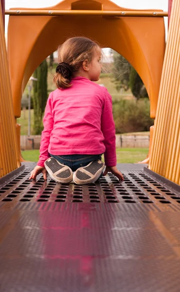 The beautiful girl play on the playground — Stock Photo, Image