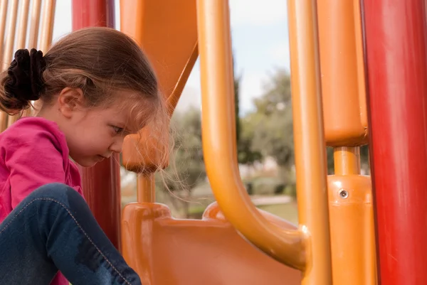 The beautiful girl play on the playground — Stock Photo, Image