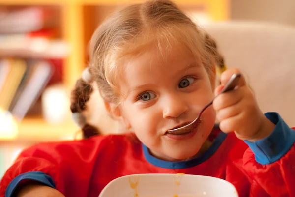 The little girl eating — Stock Photo, Image