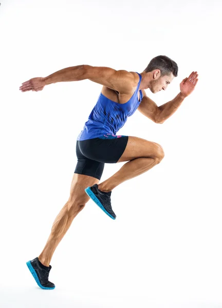 Retrato de comprimento total de um homem de fitness correndo isolado em um fundo branco — Fotografia de Stock