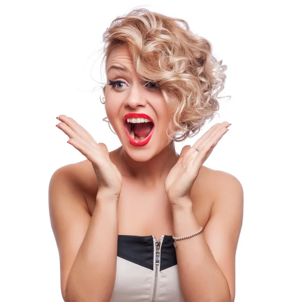 Young blonde woman shout and scream using her hands as tube, studio shoot isolated on white Stock Picture