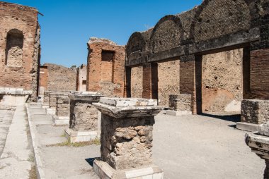 Pompeii is a ruined and partially buried Roman town-city near modern Naples in the Italian region of Campania, in the territory of the comune of Pompei..