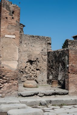 Pompeii is a ruined and partially buried Roman town-city near modern Naples in the Italian region of Campania, in the territory of the comune of Pompei..